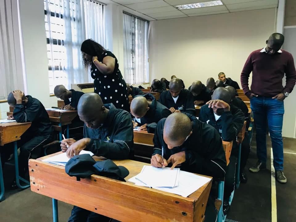 Students writing an exam in an Ukhuselo Training Academy classroom